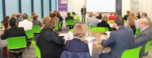 Photo of Alice speaking at an event